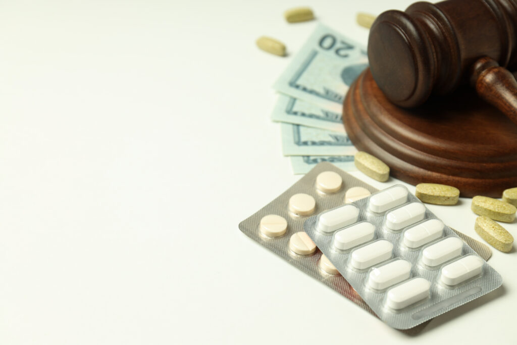 pills with gavel of justice and money, medical corruption concep pills with gavel of justice and money, medical corruption concep