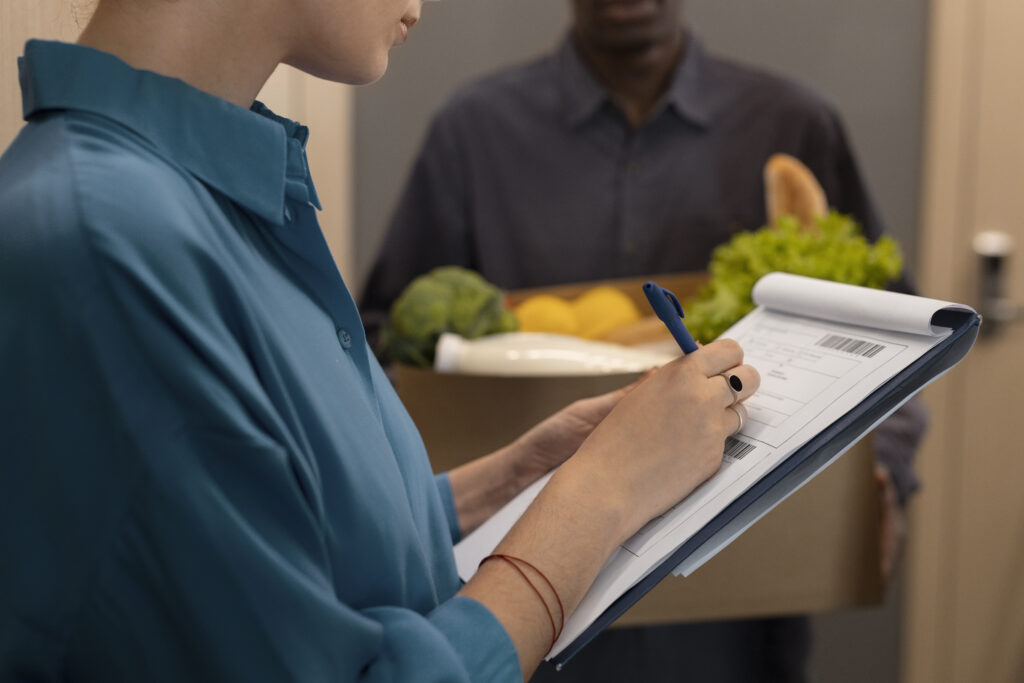 side view woman receiving groceries